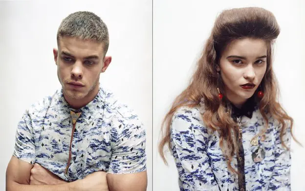 Ryan wears blue and black print shirt by Ksubi, string tie stylist’s own; Grace wears blue and black print shirt by Ksubi, earrings by Gogo Philip, string tie and badges stylist’s own