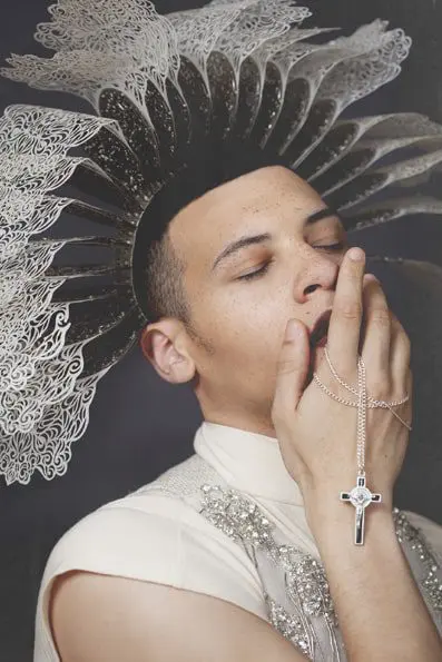 Top by Seunghwa Christina Lee; Vest by Chichi Luo; Headpiece and neckpiece by Yuanzi Wang; Cross necklace worn in hand by Ivory Jar; Nose piercing stylist own