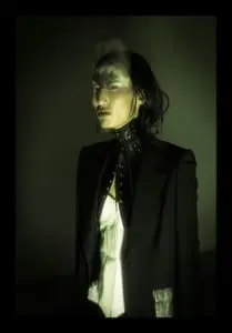 Je t'aime Taner Tumkaya: Anita wears blazer by Morris Hanks, harness by Mother of London, trousers by Harold Kensington