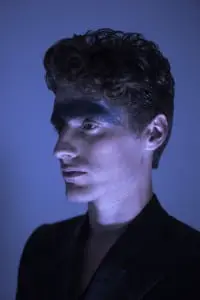 Je t'aime Taner Tumkaya: Mark wears black robe and trousers by Harold Kensington